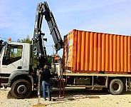 chargement d'un conteneur de location sur notre camion Somoloc FTF